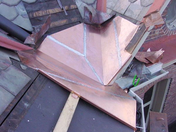 One Way To Install Standing Seam Copper Snow Aprons on a Slate Roof